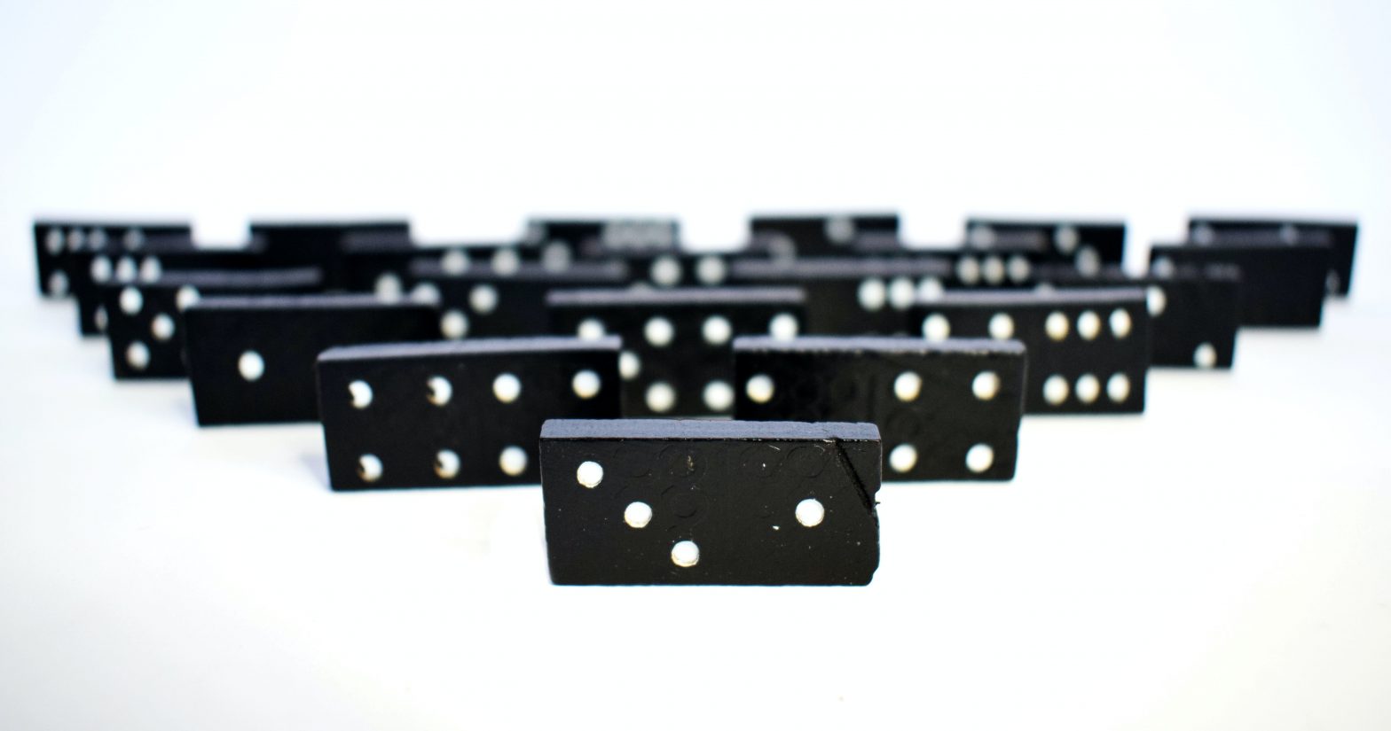 A white backround with black dominoes on their side